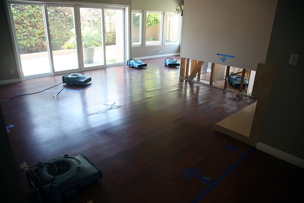 A wood floor being dried by multiple units as part of Fremontia Park, Colton flood cleanup and restoration services.